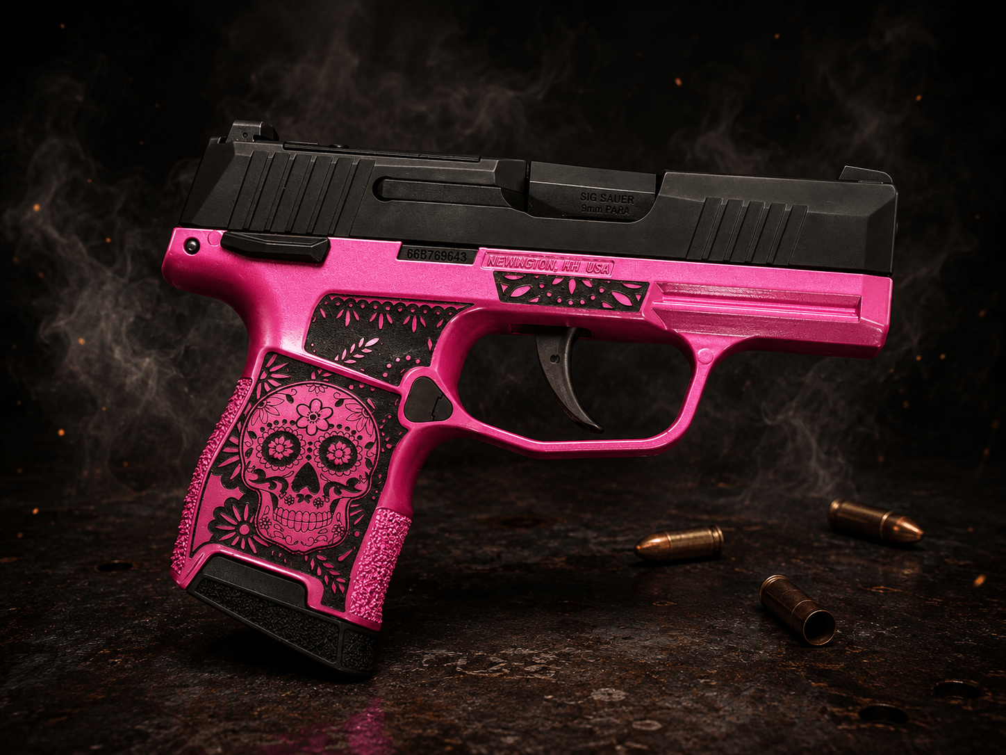 Custom-finished compact pistol with pink Cerakote frame and engraved sugar-skull grip pattern beside brass cartridges